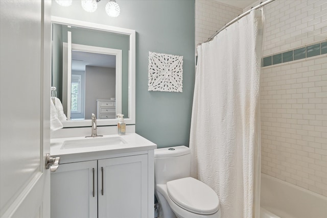 bathroom with shower / tub combo, toilet, and vanity