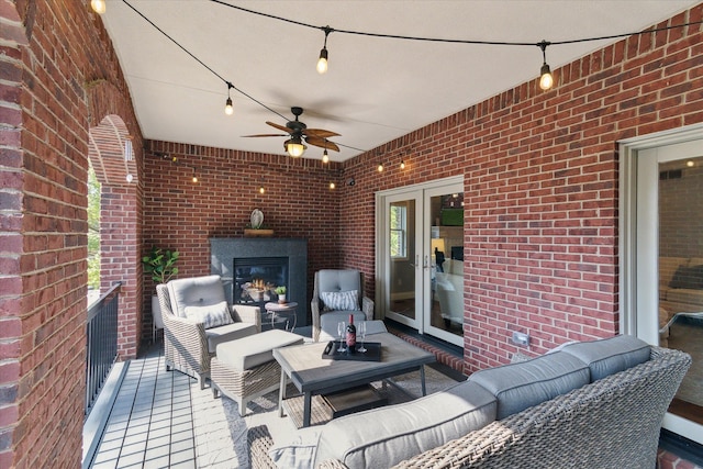 view of patio featuring outdoor lounge area, a ceiling fan, and french doors