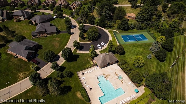 birds eye view of property with a residential view