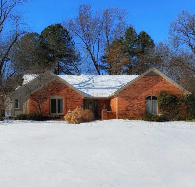 view of front of house with brick siding