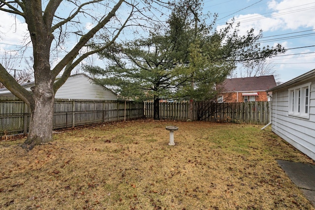 view of yard with a fenced backyard