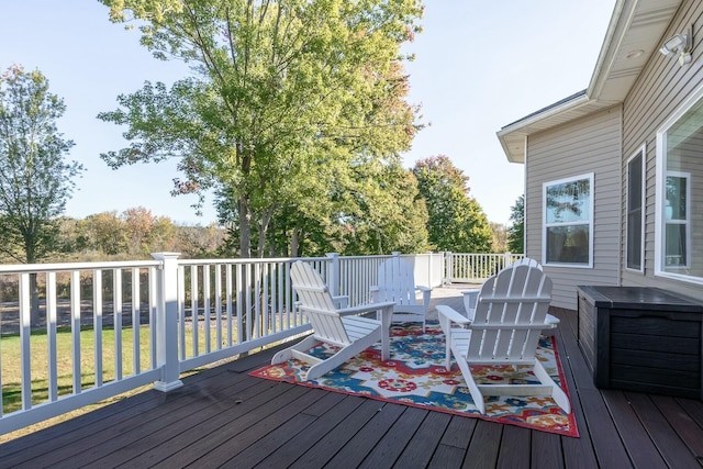 wooden terrace with a lawn