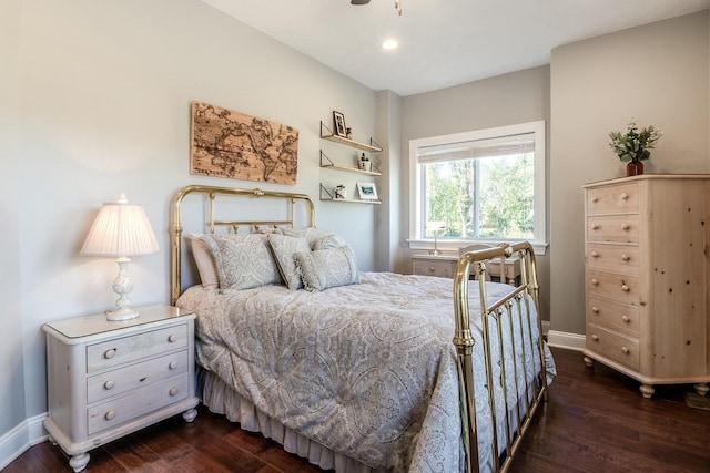 bedroom with baseboards, recessed lighting, and dark wood-style floors