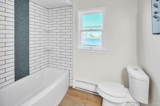 full bath featuring shower / bathtub combination, toilet, wood finished floors, and a baseboard heating unit