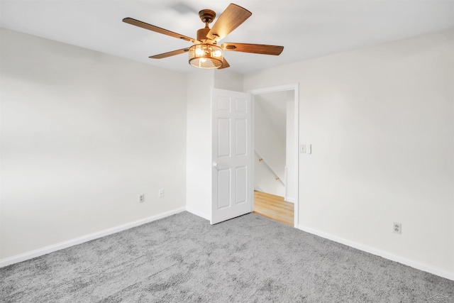 unfurnished bedroom featuring ceiling fan, baseboards, and carpet