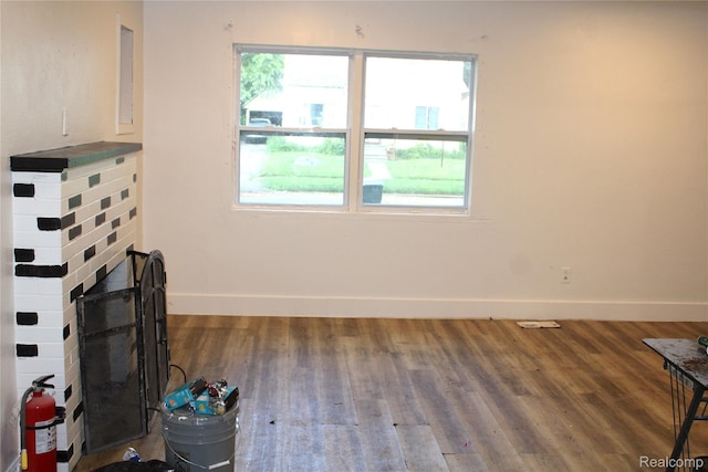 1629 Seminole St, Flint, MI 48503 - unfurnished living room with baseboards and wood finished floors