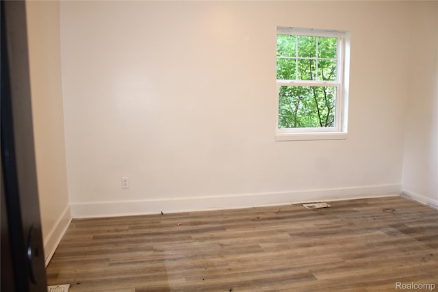 1629 Seminole St, Flint, MI 48503 - empty room with baseboards and wood finished floors
