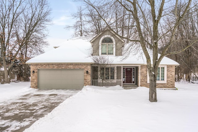 view of front of house featuring brick siding and a garage