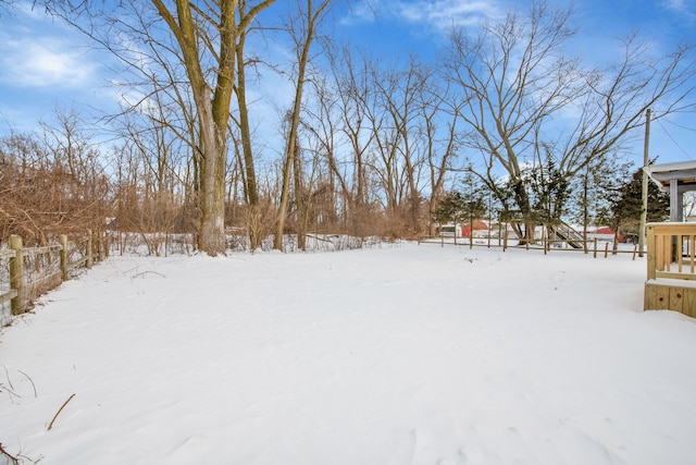 view of yard layered in snow