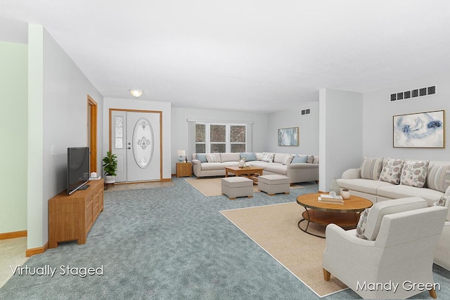 carpeted living room featuring baseboards and visible vents