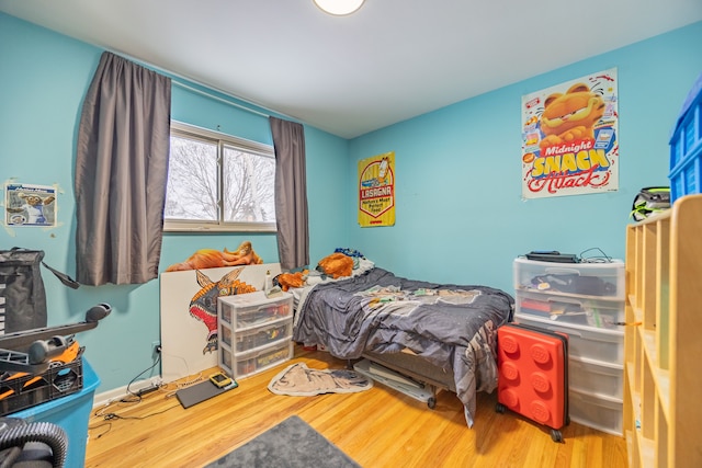 bedroom with wood finished floors