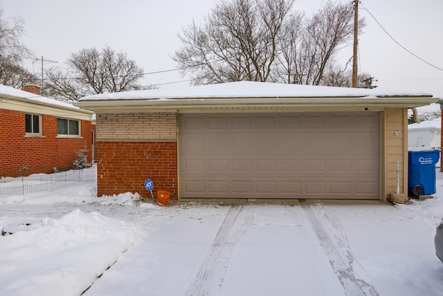 view of snow covered garage