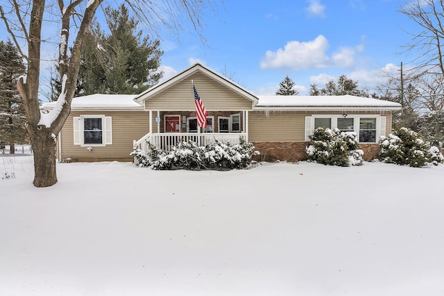 single story home featuring brick siding