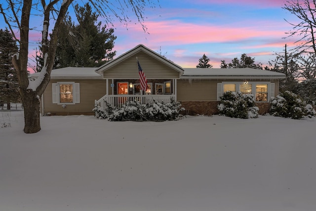 ranch-style home featuring a porch