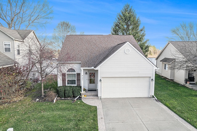 view of front of house with a garage, driveway, a front lawn, and roof with shingles