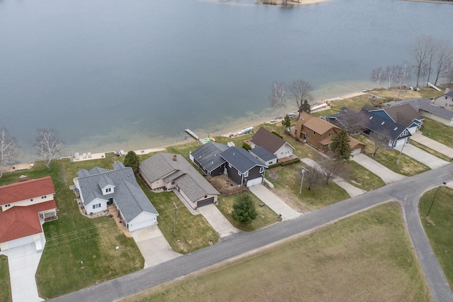 bird's eye view featuring a water view and a residential view