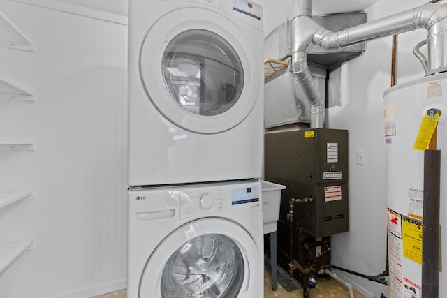 washroom with laundry area, gas water heater, and stacked washer and clothes dryer