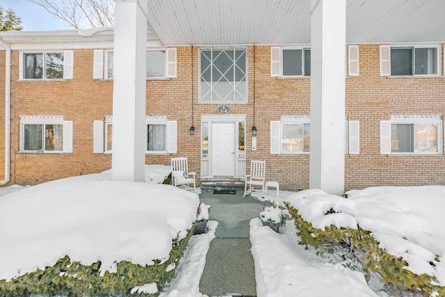 view of property featuring brick siding