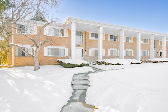 view of front of house with brick siding