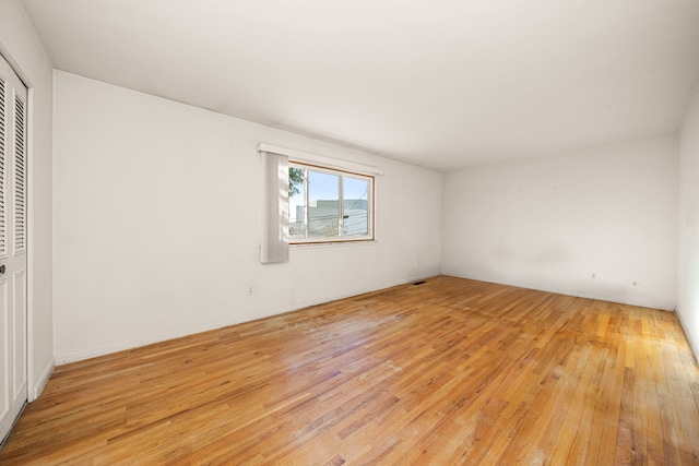 spare room with light wood finished floors