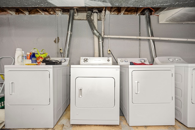 laundry room featuring washing machine and dryer and laundry area