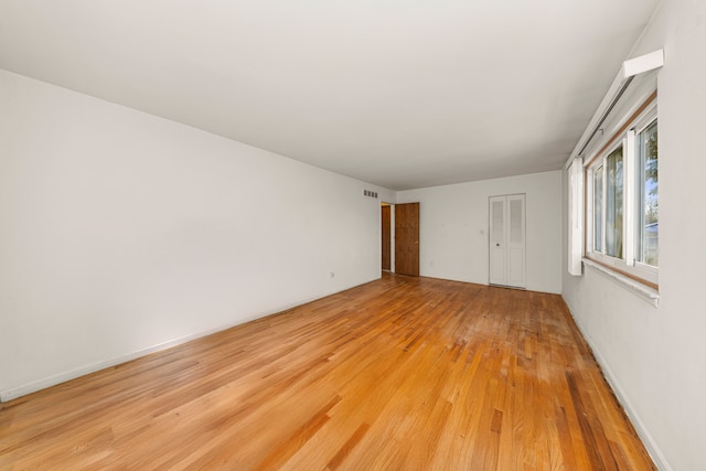 empty room with light wood-type flooring