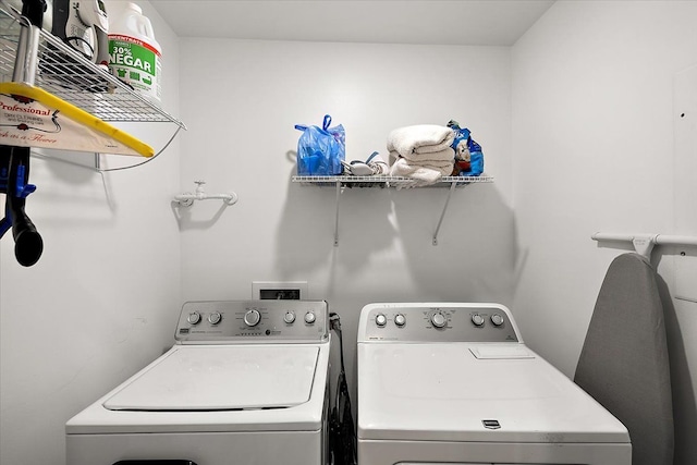 laundry area featuring laundry area and washer and dryer