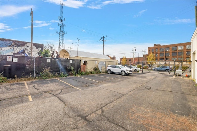 uncovered parking lot with fence