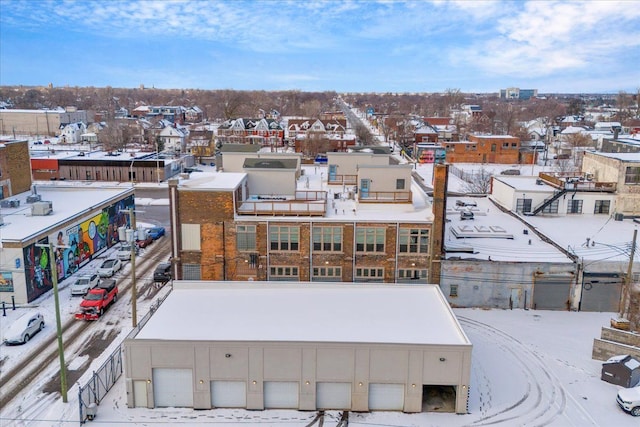 snowy aerial view featuring a residential view