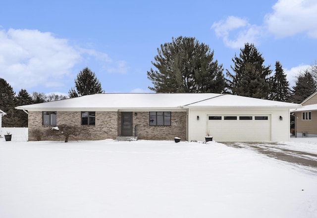 single story home with an attached garage and brick siding