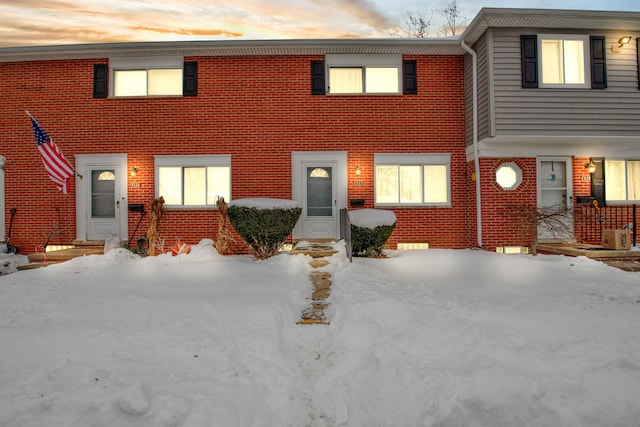 view of property with brick siding