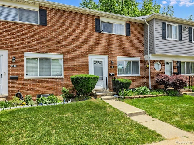 2522 Patrick Henry St, Auburn Hills, MI 48326 - townhome / multi-family property featuring a front lawn and brick siding