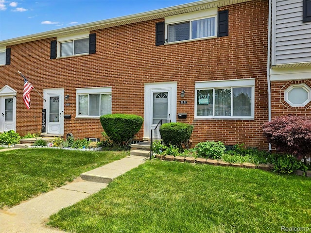 2522 Patrick Henry St, Auburn Hills, MI 48326 - view of property with brick siding and a front lawn