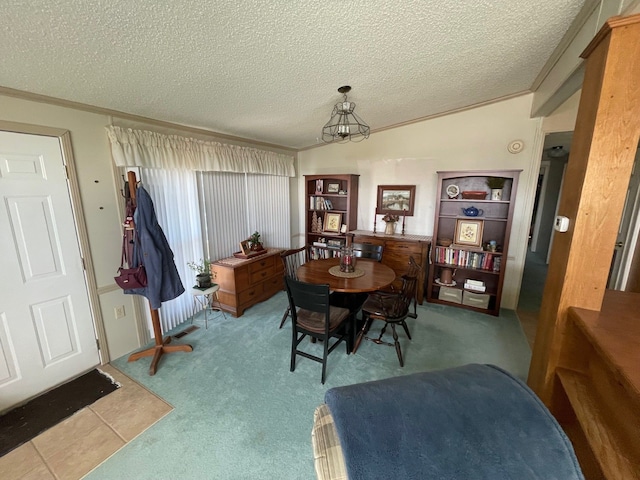 carpeted dining area with lofted ceiling and a textured ceiling