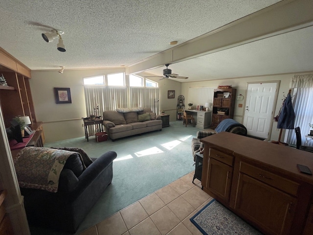 living room with lofted ceiling, light colored carpet, a textured ceiling, and light tile patterned flooring