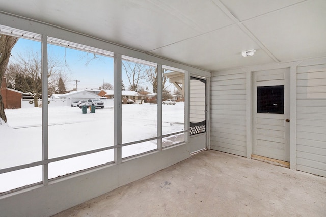 unfurnished sunroom featuring a wealth of natural light