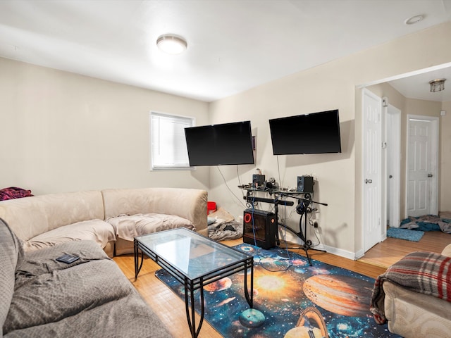 living area featuring wood finished floors and baseboards