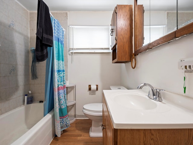 bathroom with toilet, shower / bathtub combination with curtain, vanity, and wood finished floors