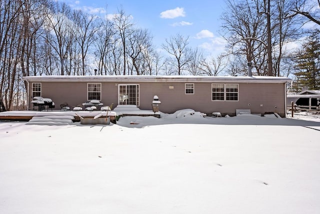 view of snow covered house