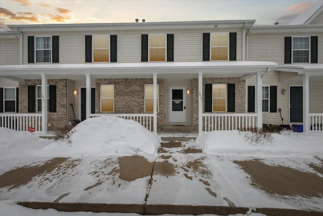 view of property with brick siding