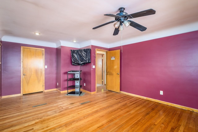 unfurnished bedroom featuring recessed lighting, wood finished floors, visible vents, and baseboards