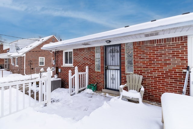 view of front of home featuring brick siding