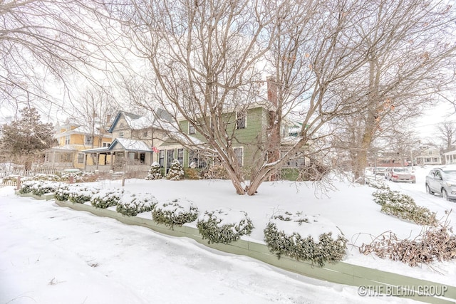 snowy yard with a residential view