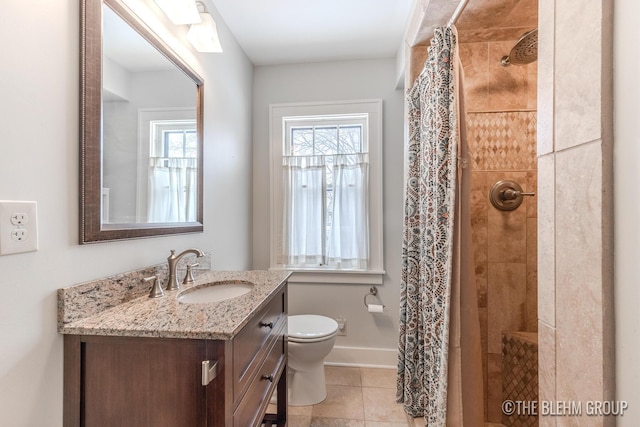 full bath with toilet, vanity, baseboards, tile patterned floors, and a stall shower