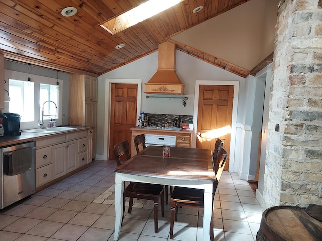 kitchen with light tile patterned floors, a sink, wood ceiling, appliances with stainless steel finishes, and custom exhaust hood