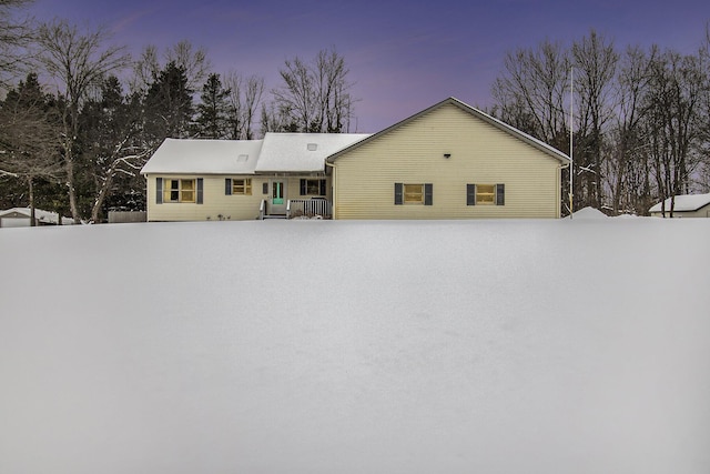 view of snow covered house