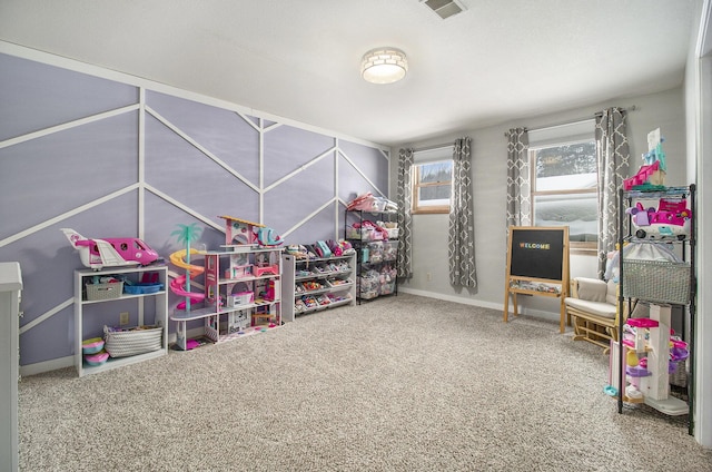 playroom featuring carpet flooring, visible vents, and baseboards