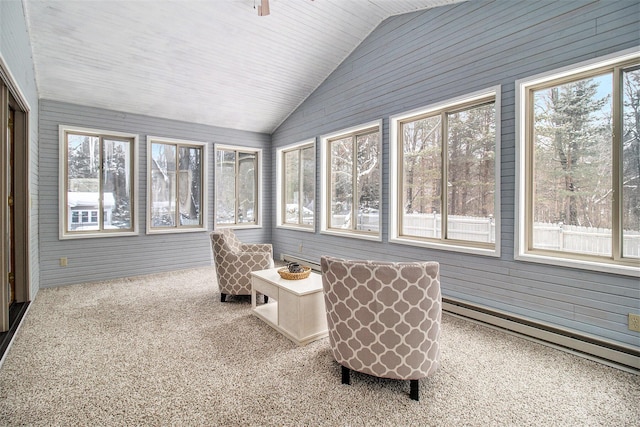 sunroom featuring lofted ceiling and plenty of natural light