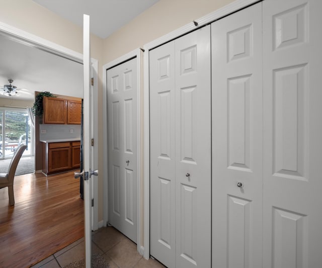 corridor featuring light tile patterned floors