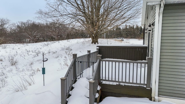 view of snow covered deck